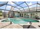Inviting screened-in pool with patio and outdoor seating at 5750 Carriage Dr, Sarasota, FL 34243