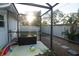 Enclosed backyard with beach ball and tropical greenery at 603 Saint Andrews Dr, Sarasota, FL 34243