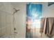 Bathroom featuring a shower with a decorative curtain, and a chrome shower head at 603 Saint Andrews Dr, Sarasota, FL 34243