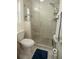 Clean bathroom with a glass enclosed shower, pebble floor and convenient toilet at 603 Saint Andrews Dr, Sarasota, FL 34243