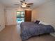 Bedroom with ceiling fan and sliding glass door, offering lots of natural light at 603 Saint Andrews Dr, Sarasota, FL 34243
