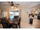 Well-lit dining area with access to the pool area and open to the updated kitchen at 603 Saint Andrews Dr, Sarasota, FL 34243