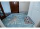A glimpse into the entryway revealing a glimpse of the exquisite tile floor at 603 Saint Andrews Dr, Sarasota, FL 34243