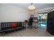 Cozy living room with a workspace overlooking the pool area at 603 Saint Andrews Dr, Sarasota, FL 34243