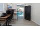 Well-lit living room space with view of pool through sliding glass door at 603 Saint Andrews Dr, Sarasota, FL 34243