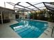 Large in-ground pool with screened-in enclosure and lots of room for entertaining or relaxing at 603 Saint Andrews Dr, Sarasota, FL 34243