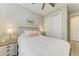 Comfortable bedroom features a wooden bed frame, crisp white linens, and ample natural light at 6094 Amberly Dr, Bradenton, FL 34208
