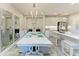 Bright dining room featuring stylish chandelier, mirrors, and modern table setting at 6094 Amberly Dr, Bradenton, FL 34208