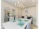 Bright dining room with decorative chandelier and large mirror at 6094 Amberly Dr, Bradenton, FL 34208