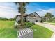 Charming townhome featuring a two-car garage, palm trees, and a well-manicured lawn in a quiet community at 6094 Amberly Dr, Bradenton, FL 34208