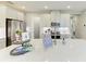 Well-lit kitchen island offering stone countertops and bar stool seating at 6094 Amberly Dr, Bradenton, FL 34208