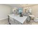 Kitchen island with view of dining room, living room and kitchen appliances at 6094 Amberly Dr, Bradenton, FL 34208