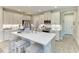 Bright modern kitchen with island, stainless appliances, and ample counter space at 6094 Amberly Dr, Bradenton, FL 34208