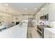Open concept kitchen with large island, stainless steel appliances, and breakfast bar at 6094 Amberly Dr, Bradenton, FL 34208