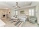 Cozy living room with a ceiling fan, comfortable seating, and stylish decor creates a relaxing atmosphere at 6094 Amberly Dr, Bradenton, FL 34208
