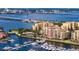 Stunning aerial view of waterfront condos, yachts, and bridges under a sunny sky at 610 Riviera Dunes Way # 308, Palmetto, FL 34221