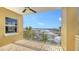 Balcony with white railings with a beautiful view of the water and boats at 610 Riviera Dunes Way # 308, Palmetto, FL 34221