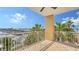Spacious balcony offers views of the water, palm trees, and the surrounding community at 610 Riviera Dunes Way # 308, Palmetto, FL 34221