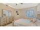 Bedroom features a bed, dresser with mirror and a window at 610 Riviera Dunes Way # 308, Palmetto, FL 34221
