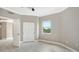 Bedroom with closet, bright window, and tile floors at 610 Riviera Dunes Way # 308, Palmetto, FL 34221