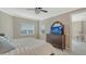 Cozy bedroom with neutral colors, comfortable bedding, and dark wood furniture at 610 Riviera Dunes Way # 308, Palmetto, FL 34221