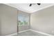 Bedroom with large windows and tile floors at 610 Riviera Dunes Way # 308, Palmetto, FL 34221