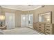 Cozy bedroom with neutral tones and an ensuite bathroom at 610 Riviera Dunes Way # 308, Palmetto, FL 34221