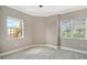 Bedroom with bright windows allowing natural light at 610 Riviera Dunes Way # 308, Palmetto, FL 34221