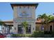 Riviera Dunes Marina Resort building featuring Dockside Social Bar & Grill and palm tree landscaping at 610 Riviera Dunes Way # 308, Palmetto, FL 34221