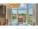 Dining area boasts walls of windows with stunning views of a pool and lush landscaping at 610 Riviera Dunes Way # 308, Palmetto, FL 34221