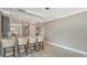 Kitchen bar with seating area with granite counters and tile floor at 610 Riviera Dunes Way # 308, Palmetto, FL 34221