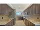 Modern kitchen featuring stainless steel appliances, granite counters, and tiled backsplash at 610 Riviera Dunes Way # 308, Palmetto, FL 34221