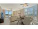 Bright living room with a dining area, tile flooring, and a beautiful view of the water at 610 Riviera Dunes Way # 308, Palmetto, FL 34221