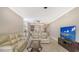 Cozy living room with tile floors, neutral paint, ceiling fan, and comfortable seating at 610 Riviera Dunes Way # 308, Palmetto, FL 34221