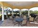 Outdoor patio seating area perfect for community gathering with tables and chairs at 610 Riviera Dunes Way # 308, Palmetto, FL 34221