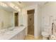 Well-lit bathroom with a spacious vanity, glass-enclosed shower, and neutral color palette at 6101 34Th W St # 28E, Bradenton, FL 34210