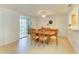 Bright dining area with ample seating, stylish lighting, and easy access to the living spaces at 6101 34Th W St # 28E, Bradenton, FL 34210
