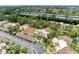 Exterior view of condominiums with tropical landscaping and carports in a vibrant community at 6101 34Th W St # 28E, Bradenton, FL 34210