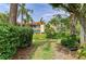 Exterior building view, showcasing the lush landscaping and serene surroundings of this delightful community at 6101 34Th W St # 28E, Bradenton, FL 34210