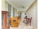 Cozy Florida room features tile flooring, a ceiling fan, and comfortable seating, perfect for relaxing and enjoying the views at 6101 34Th W St # 28E, Bradenton, FL 34210