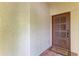 Inviting front door featuring an ornate design, a welcome mat, and terra cotta tile flooring at 6101 34Th W St # 28E, Bradenton, FL 34210