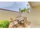 Outdoor patio area features seating area with table, umbrella, and stone floor at 6101 34Th W St # 28E, Bradenton, FL 34210