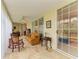 Cozy sunroom with comfortable seating, tiled floors, and sliding glass doors to enjoy the natural light at 6101 34Th W St # 28E, Bradenton, FL 34210