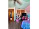 Bright bedroom with wood floors, ceiling fan and built-in storage is ready to move in at 6265 Viola Ln, New Port Richey, FL 34653