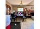 Cozy dining area with table, benches, and nearby fireplace at 6265 Viola Ln, New Port Richey, FL 34653