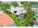 Aerial view showcasing a spacious backyard, pool, and well-maintained landscaping at 6470 Indigo Bunting Pl, Lakewood Ranch, FL 34202