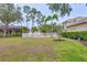 Expansive backyard offers plenty of space for activities and features a white fence and mature landscaping at 6470 Indigo Bunting Pl, Lakewood Ranch, FL 34202