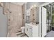 Bathroom featuring dual shower heads and a modern sink with a door leading to the backyard at 6470 Indigo Bunting Pl, Lakewood Ranch, FL 34202