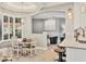 Bright breakfast nook features a charming round table, modern light fixture, and an archway leading to living area at 6470 Indigo Bunting Pl, Lakewood Ranch, FL 34202