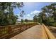 Charming wooden bridge with scenic views of the water and surrounding green landscape at 6470 Indigo Bunting Pl, Lakewood Ranch, FL 34202